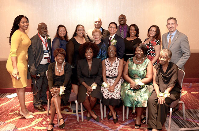 Picture of NEOA members taken with Viola Davis and family at the 2018 Council for Opportunity conference in New York City